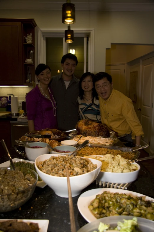 an image of the family smiling at a large buffet