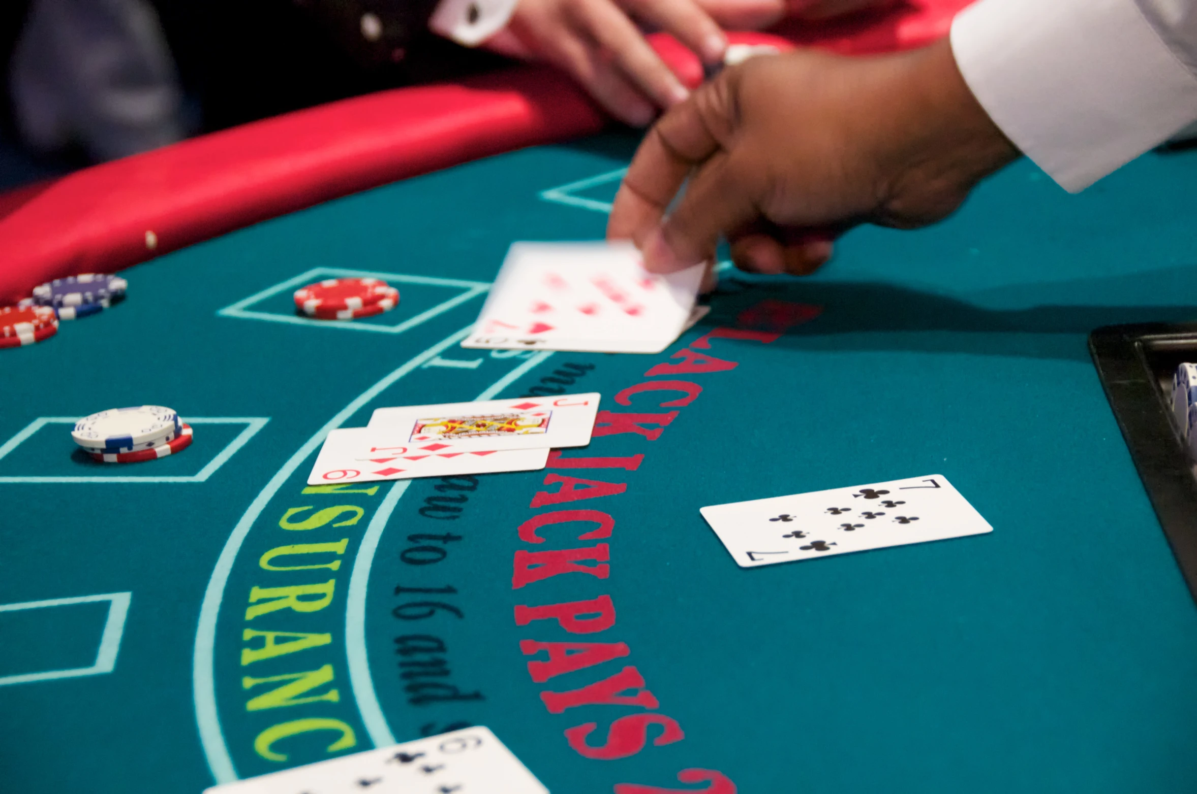 a table with a person playing cards on it