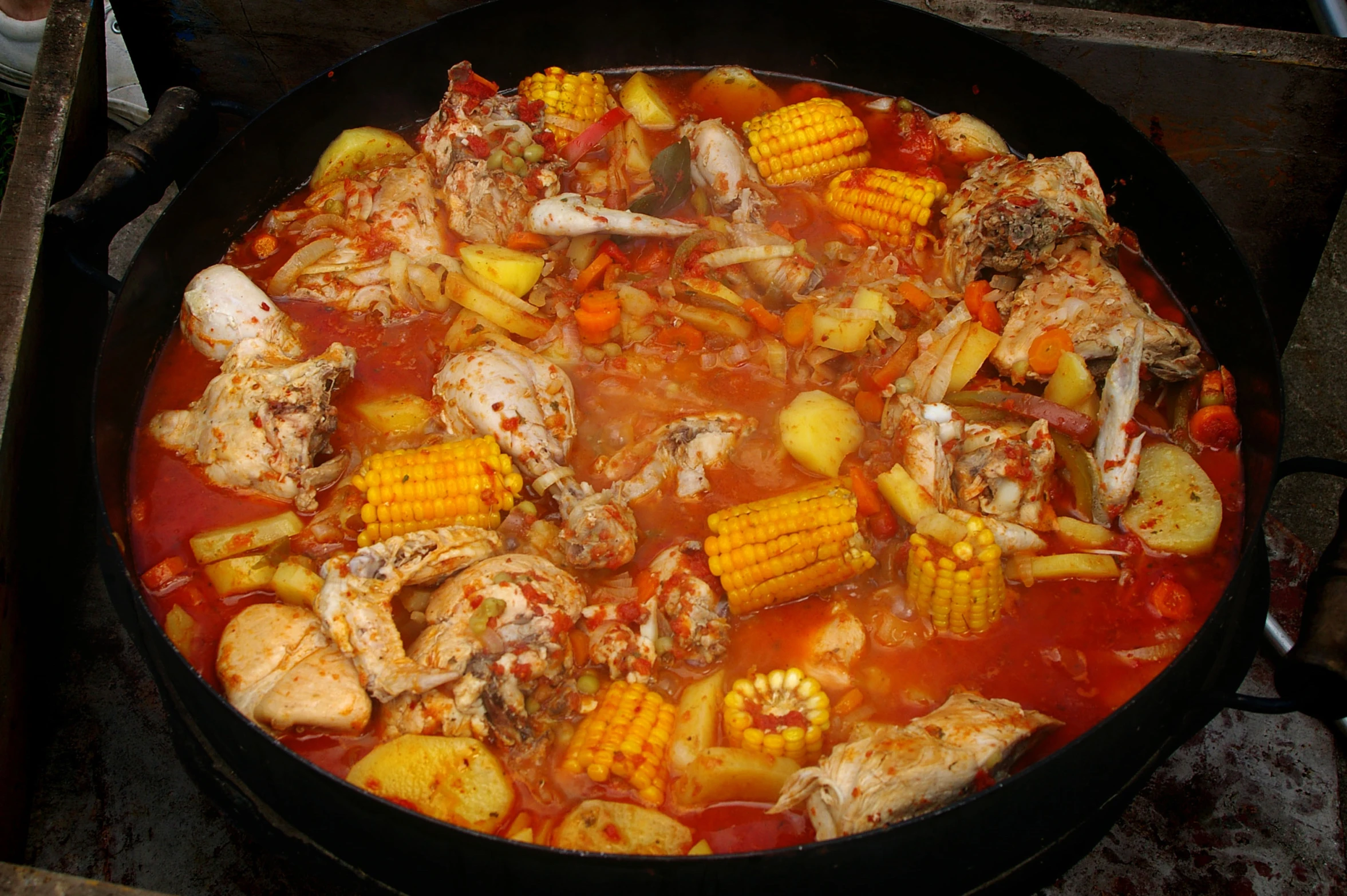 a  pot filled with food cooking on a stove