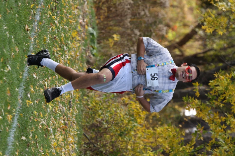 a person riding on the back of another person in running gear