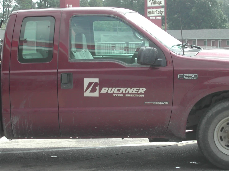 a truck parked in front of a gas station