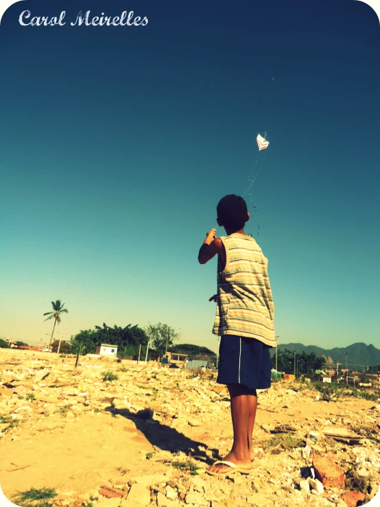 a person flying a kite on the beach