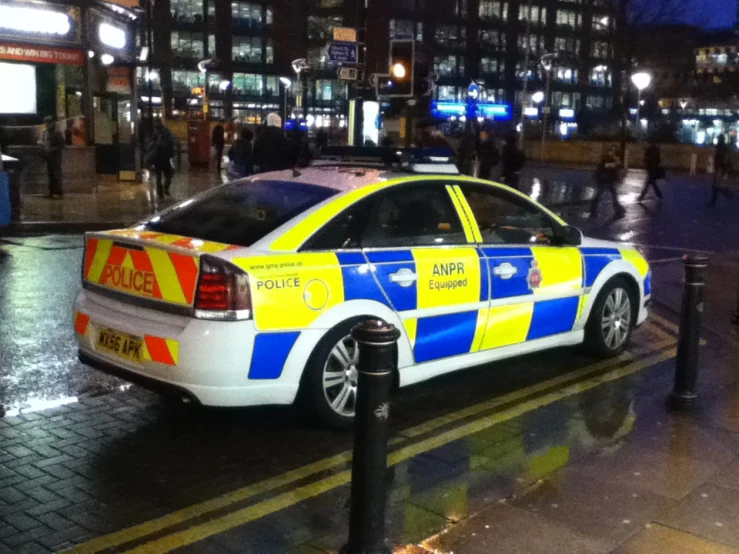 a cop car sitting on the side of a road