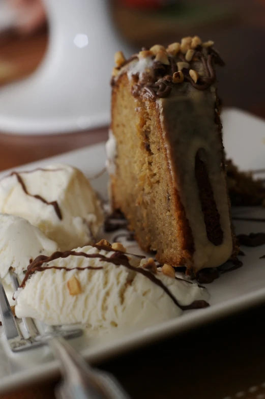 half eaten slice of desert sitting on a white plate