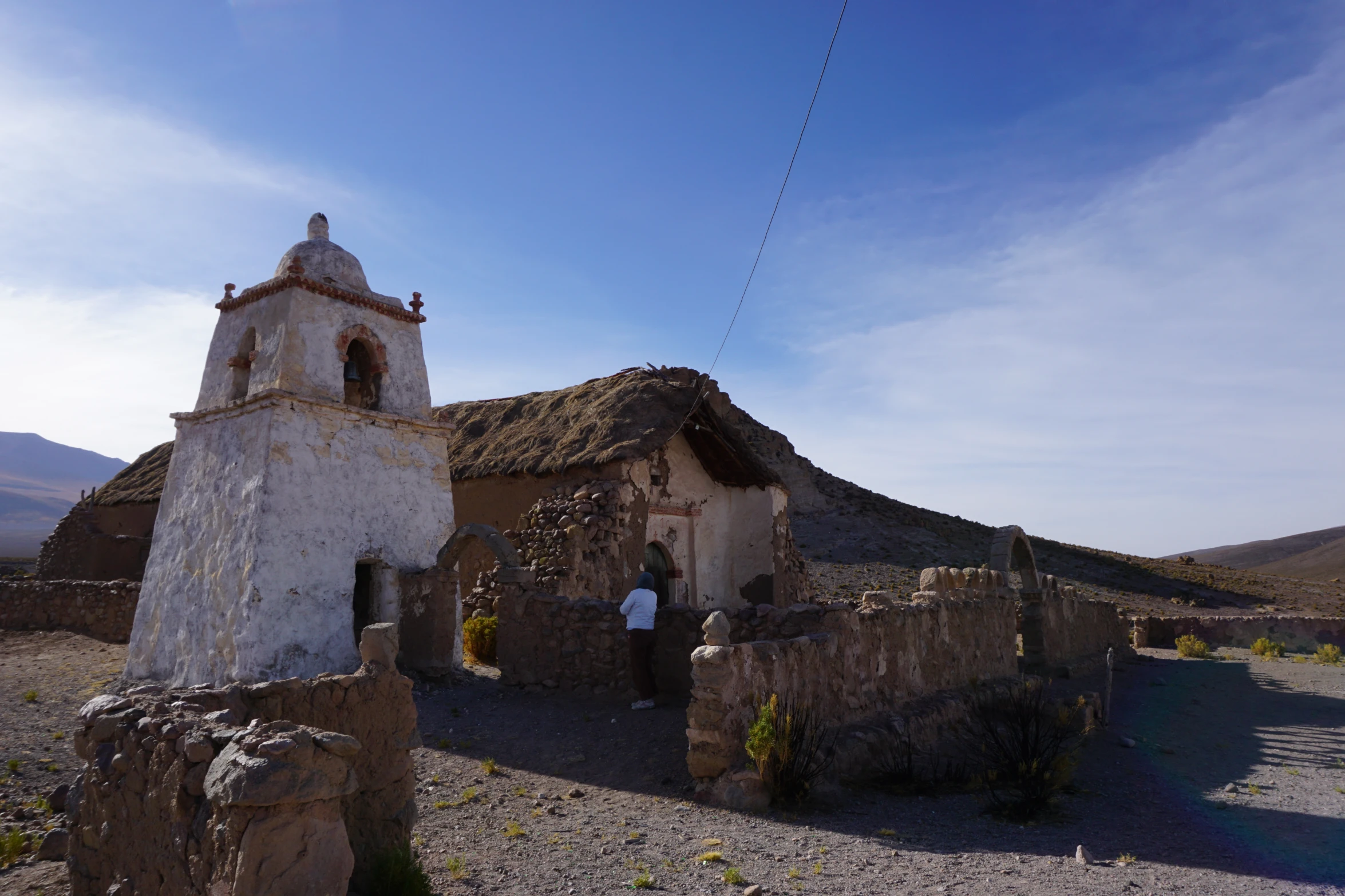 a church in the middle of nowhere on a hill