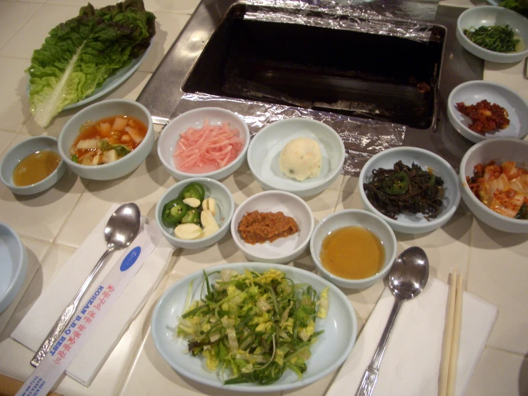 bowls with various ingredients in them sitting on a table