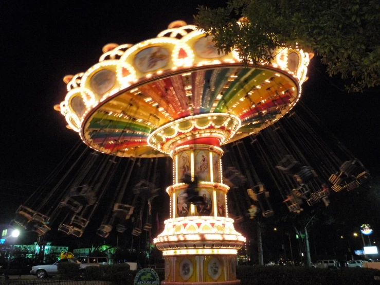 a merry go round at night, with lights
