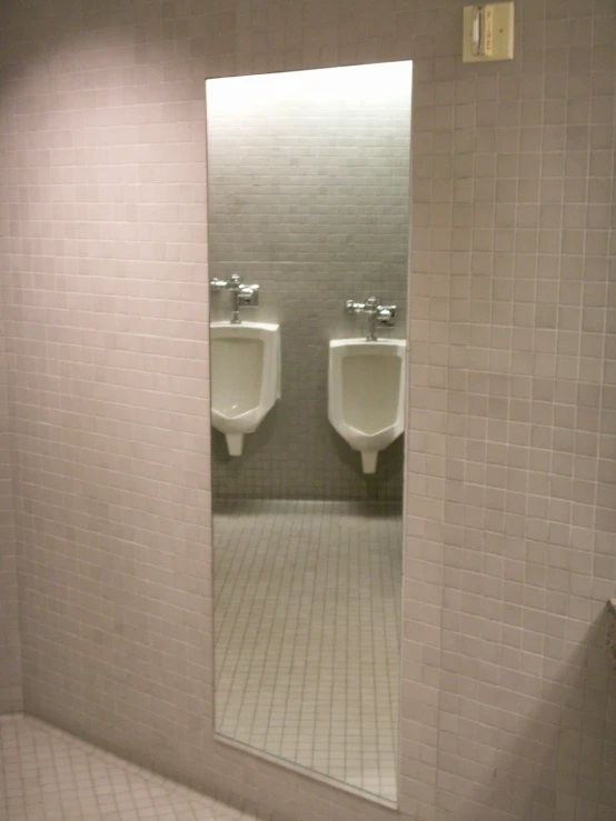 an urinal that is very small in a public bathroom