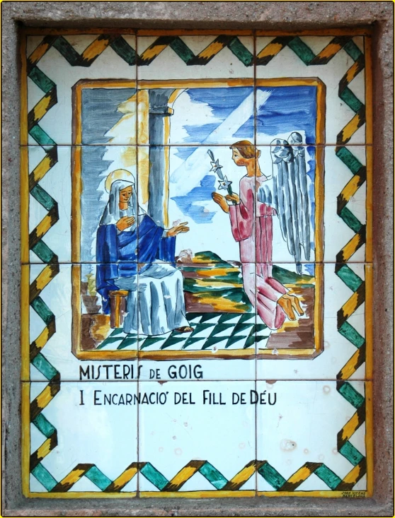 a tile with a depiction of people standing on a table