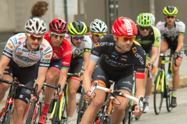 many cyclists racing down the road in an extreme race