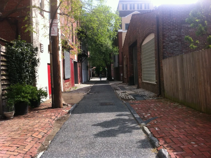 brick lined streets are lined with trees and brick walls