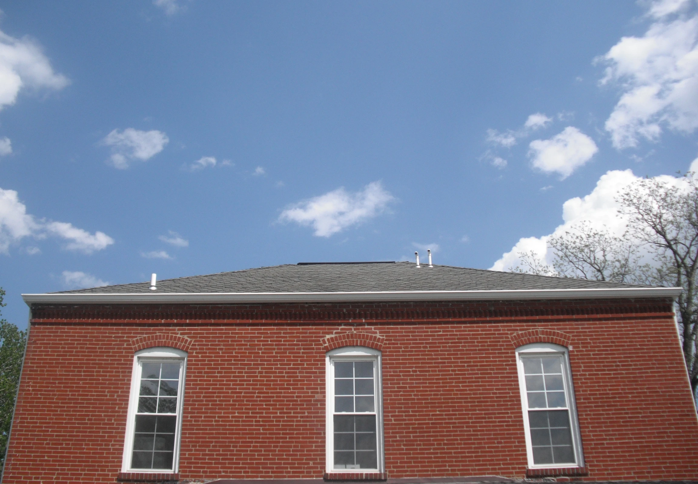 a picture of a brick building with white trim