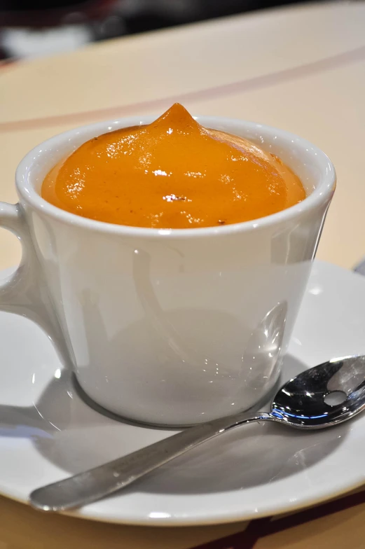 a spoon and some food in a bowl