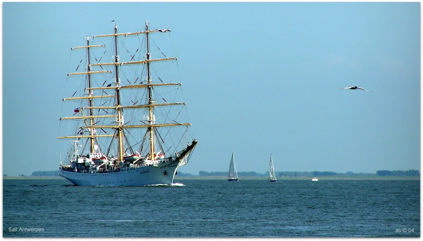 a large sail ship sailing in the open ocean