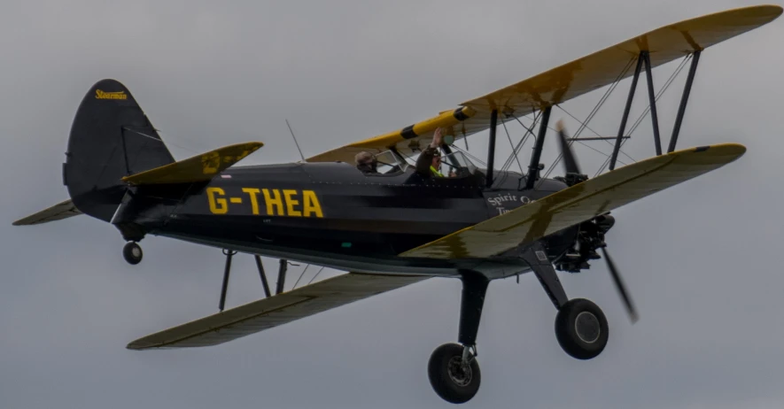 an airplane that has two people in the cockpit