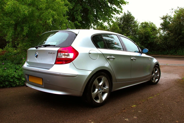 a silver car is parked in a driveway