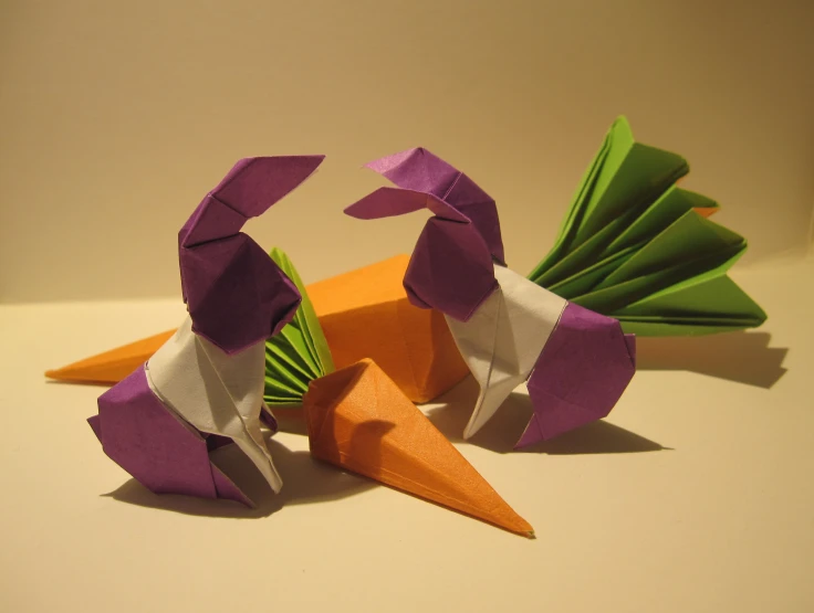 a close up of several folded paper objects