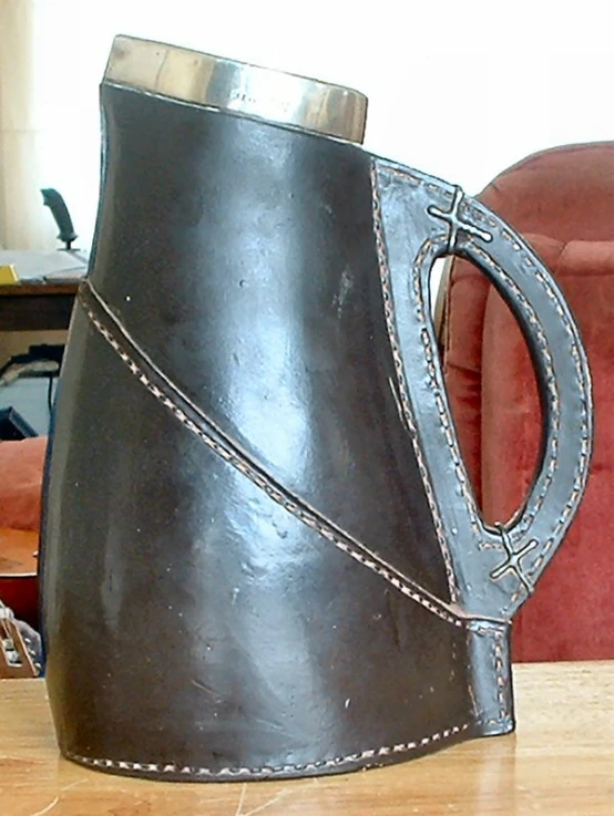 a large vase sitting on top of a wooden table