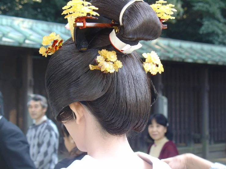 woman in traditional chinese hairs with flowers on her hair