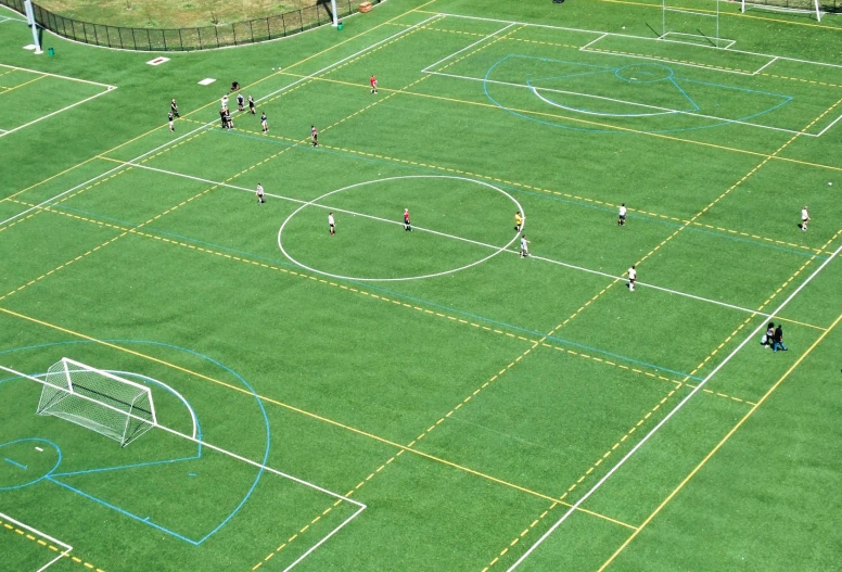 an overhead view of a soccer field with people on it