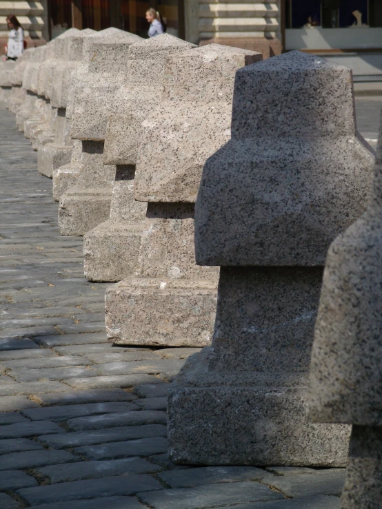 some very pretty grey stone sculptures on the sidewalk