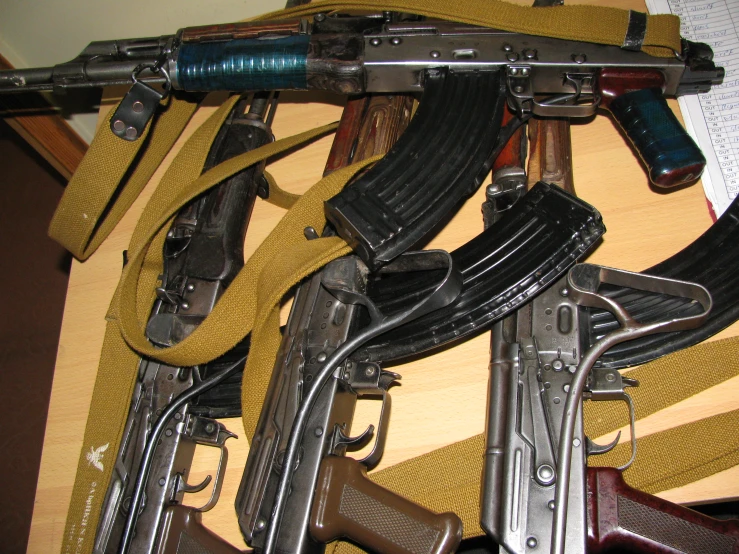 an array of guns displayed in a display case