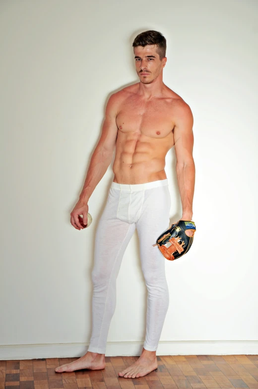 a man wearing white underwear and holding a baseball glove