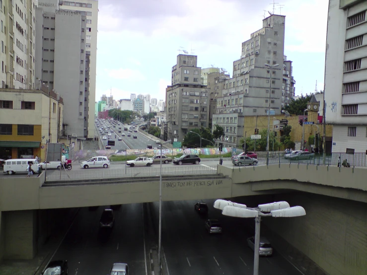 an overhead highway in the middle of several buildings