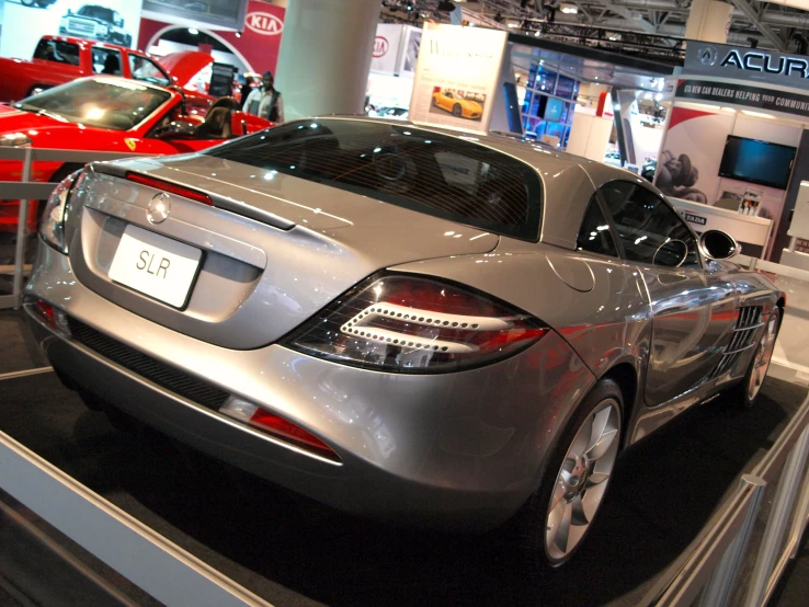 the rear of a mercedes car sits on display