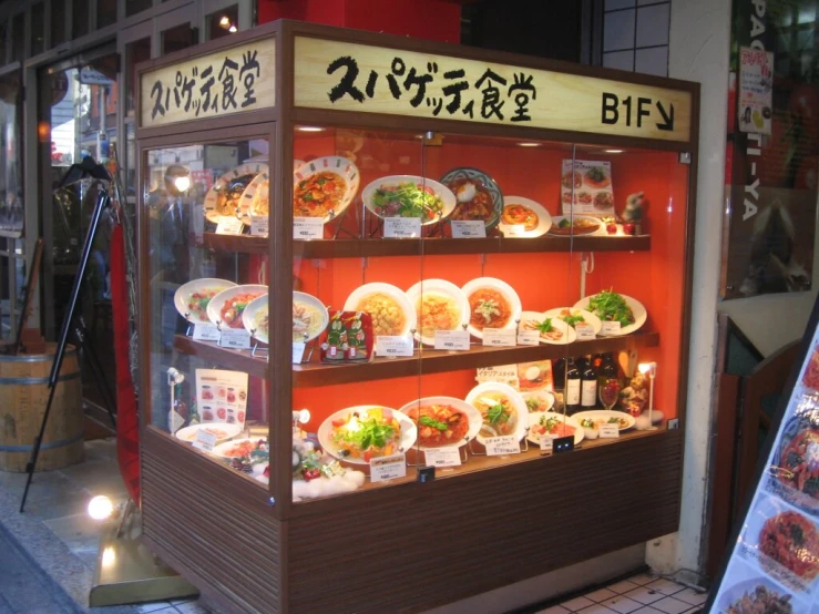 an asian oriental shop is set up in front of a street