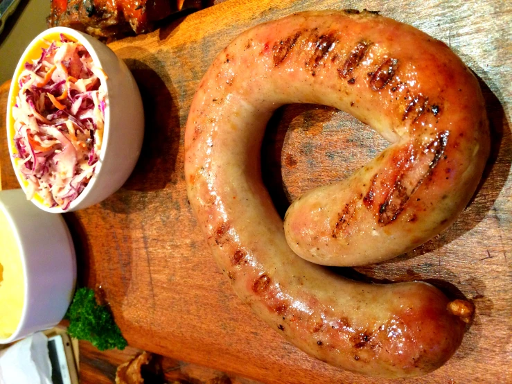  dog in the shape of a doughnut and plate with side dishes