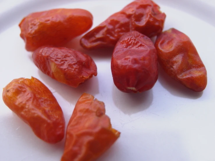 some gourmet red vegetables are on a white plate