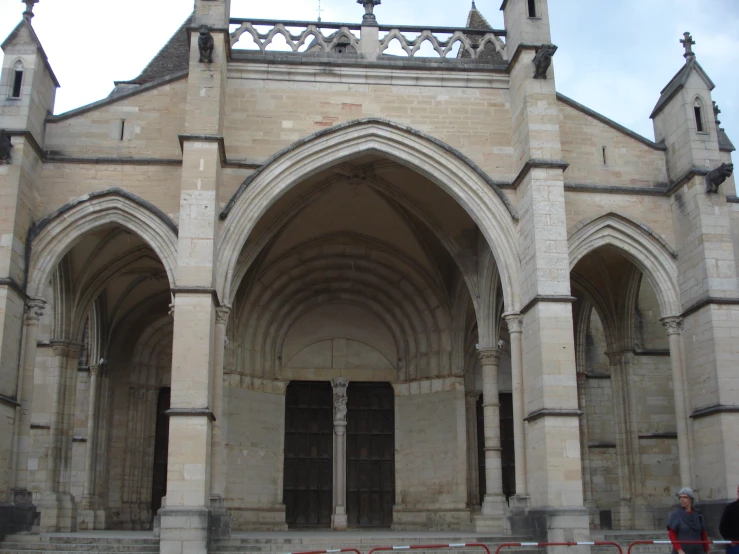 an archway in a brick building with ornate architecture