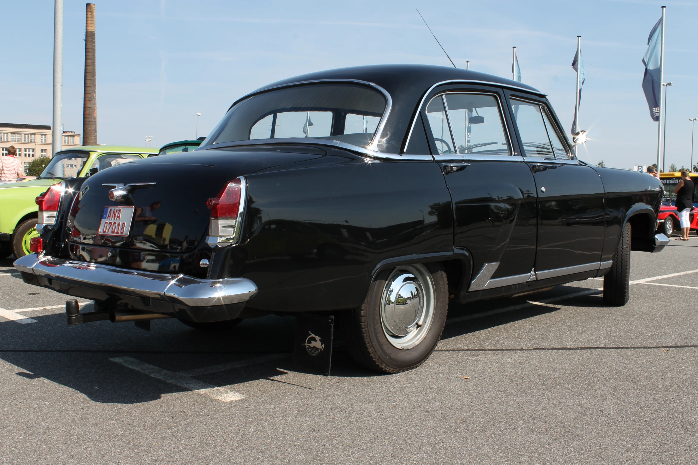 an antique car parked on the side of the road