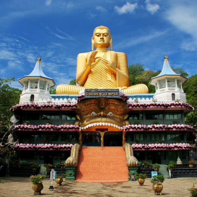 there is a large buddha statue in front of a building