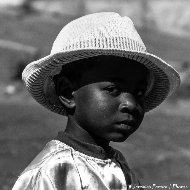 black and white po of a  with a hat