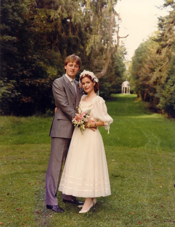 an older man and woman in old fashioned wedding clothes