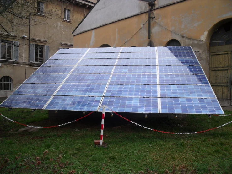 a solar panel is attached to a green lawn