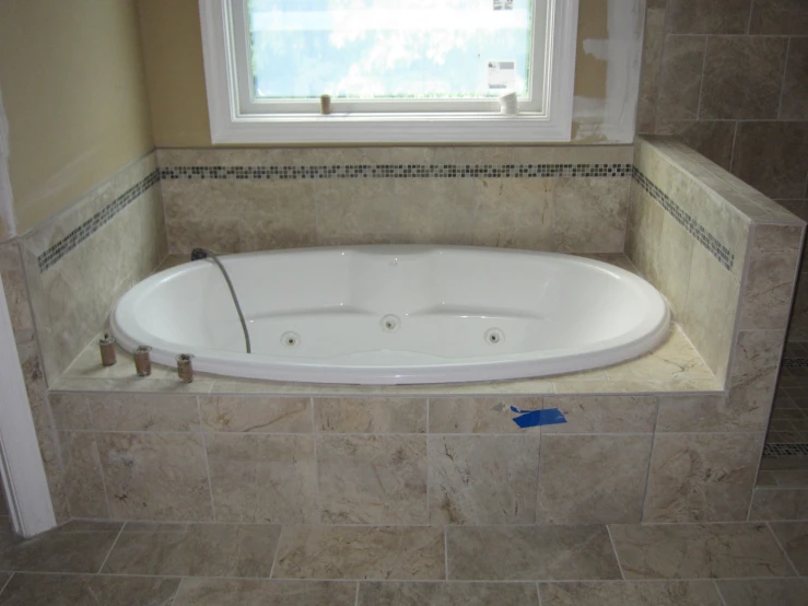 a corner bath tub with its door open