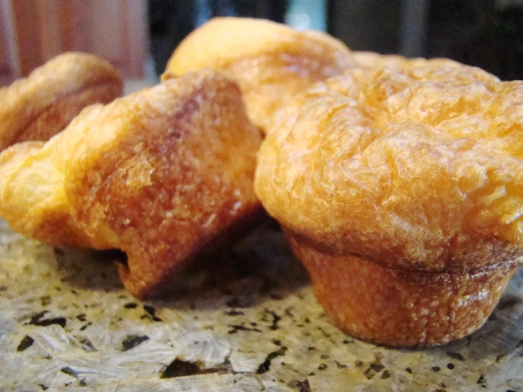 pastries sitting on top of a granite counter