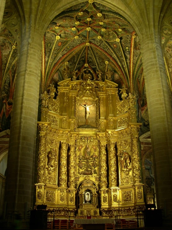 an elaborate, golden shrine sits in a room