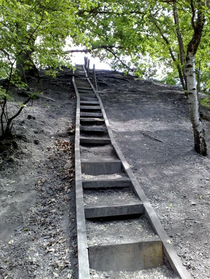 a group of people walking up a steep set of stairs