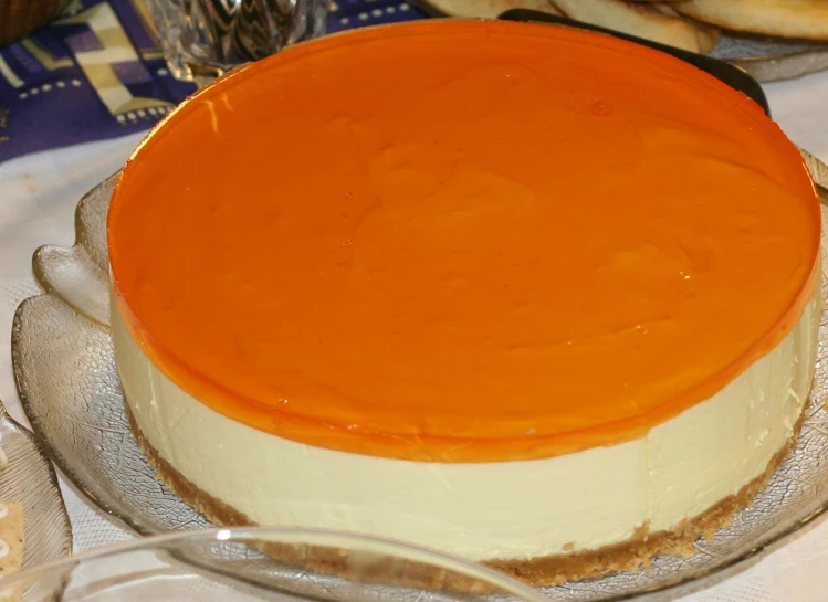 a cake is decorated with an orange on top