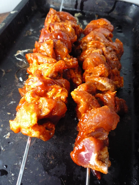 a closeup s of an assortment of chicken skewers