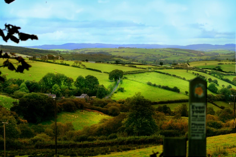 a view down a valley with some grass in it