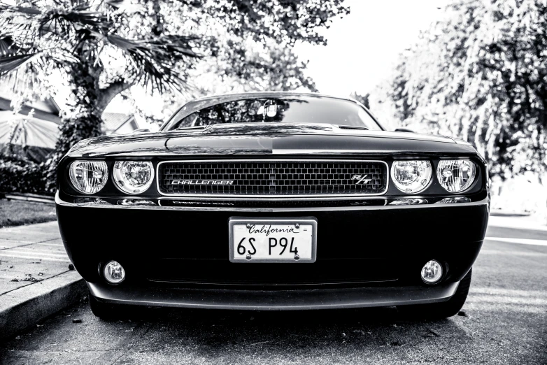 black and white pograph of a car on the street