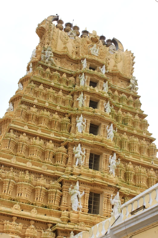 the structure of an ancient building is covered with statues