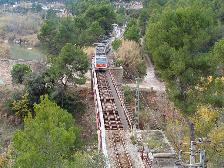 a train that is riding the railroad tracks