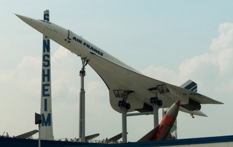 a white and blue plane with the name of the aircraft on it