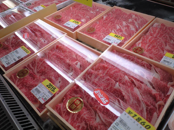 a butcher shop with different types of raw meat